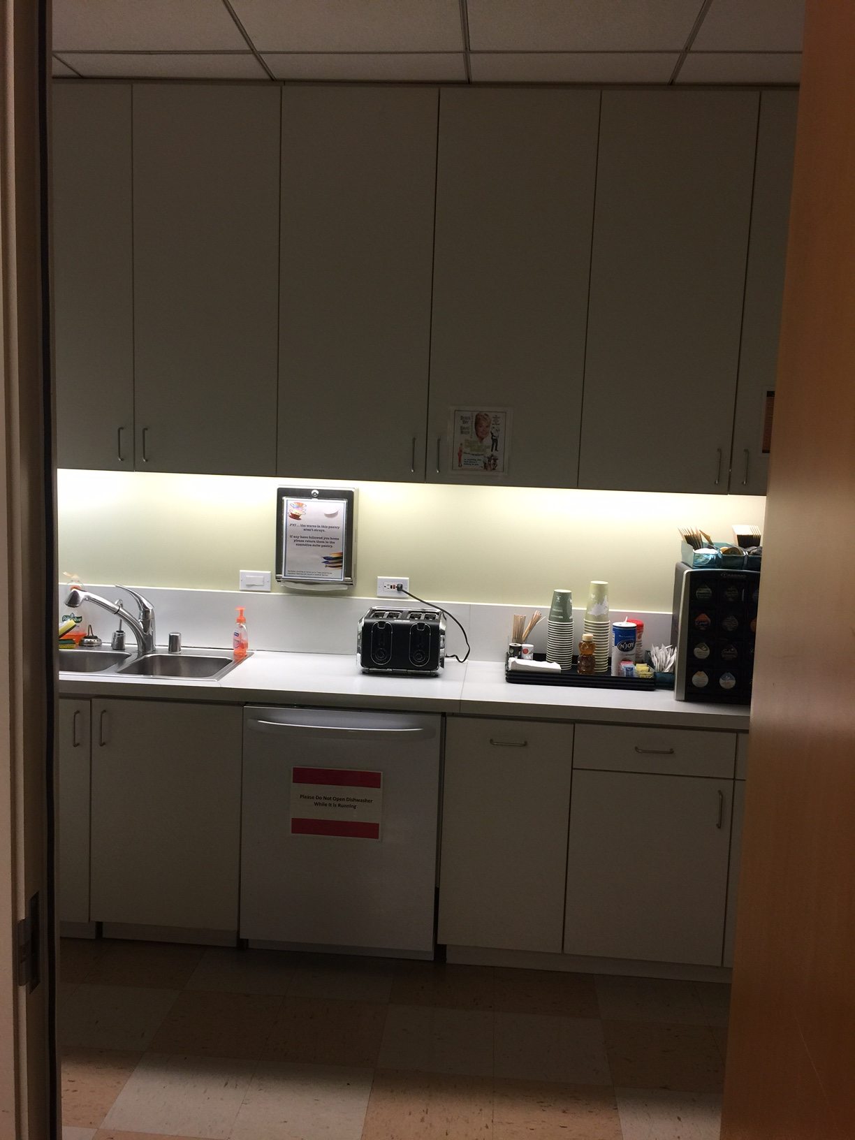 Breakroom cabinetry, sink, and appliances — image 2
