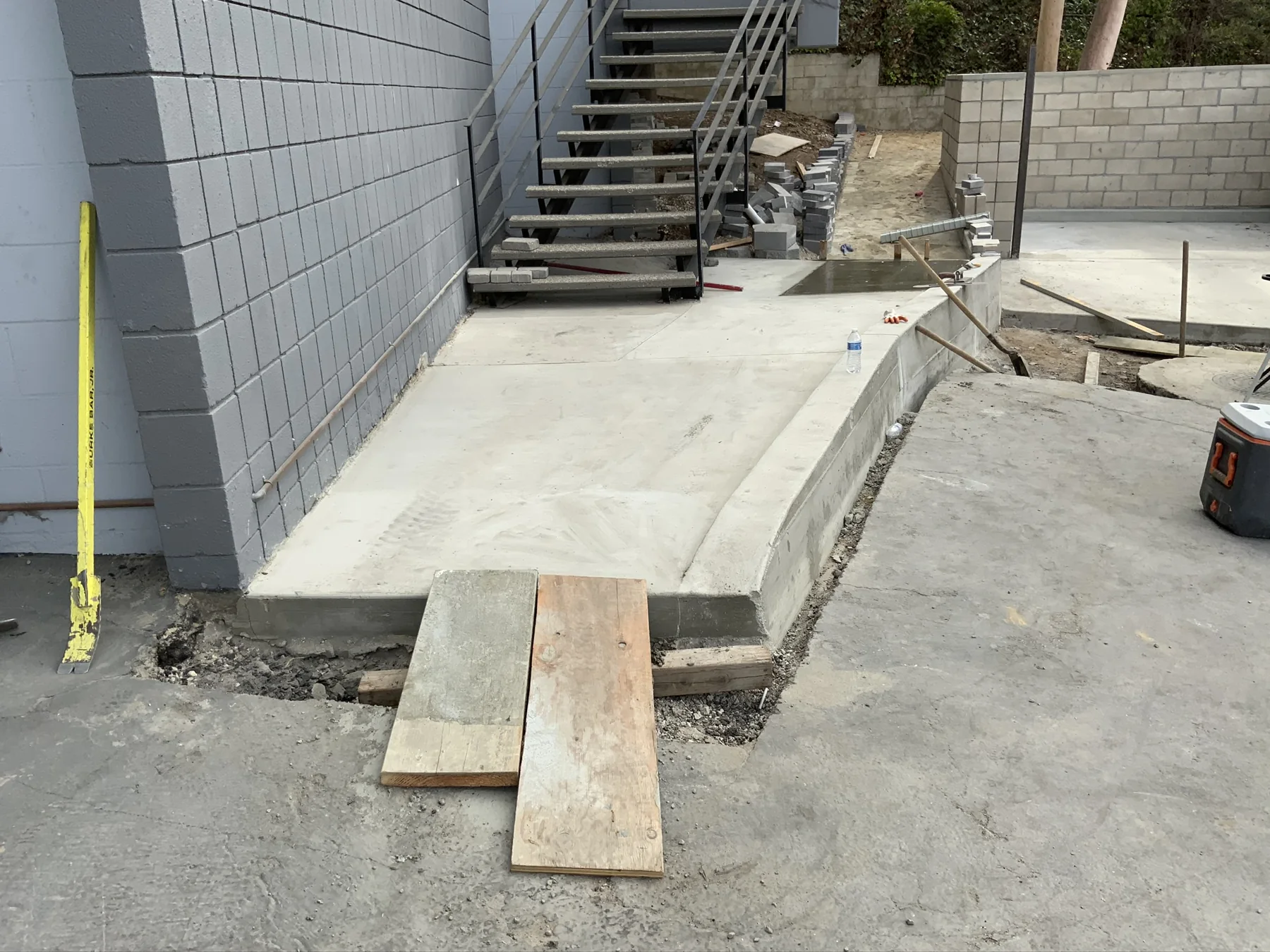 Finished concrete route beside the building — image 6